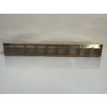 Madia1 drapp billenő doboz sor 9 fiók